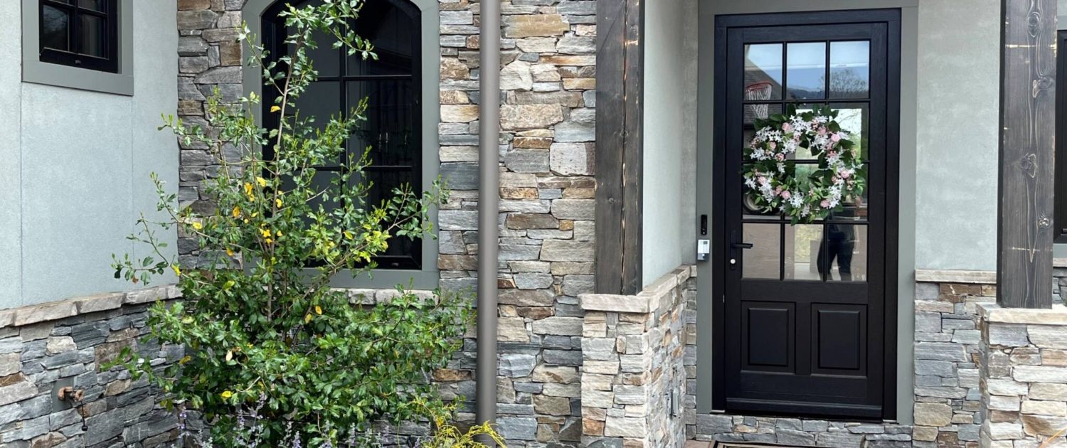 chocolate grey ledge stone , natural stone siding, stacked stone siding, cliffs at walnut cove home